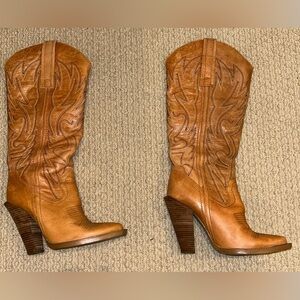 Camel/caramel color knee-high cowboy boots with 4.5 inch heels.